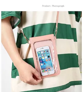 Detailed view of a pink crossbody mobile phone bag featuring a clear touchscreen window
