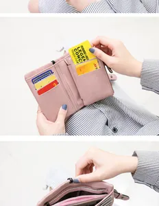 Detailed view of internal card slots and compartments in a pink faux leather wallet