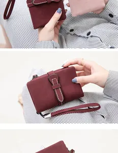 Detailed view of burgundy PU leather short wallet with wrist strap and buckle