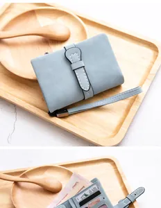 Detailed interior and exterior view of light blue soft PU leather ladies short wallet