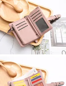Internal detail of a pink PU leather wallet showing card slots and ID window