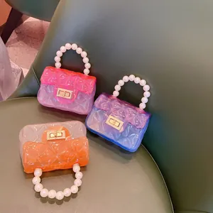Mini borse jelly in PVC trasparente con manici di perle e motivo trapuntato colorato