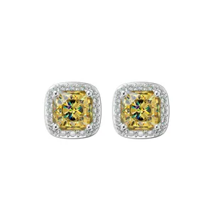 Hip hop style silver stud earrings featuring square yellow cushion-cut stones and clear halo