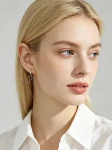 Close-up of S925 silver hoop earrings with sparkling zircon and marquise stone