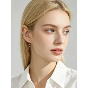 Elegant S925 silver hoop earrings with marquise zircon stones worn by a professional model