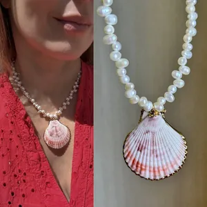 Elegant natural pearl necklace featuring a pink shell pendant for stylish beach vacations