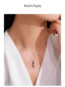 Detailed view of a 925 sterling silver necklace with a geometric multi-colored gem pendant.
