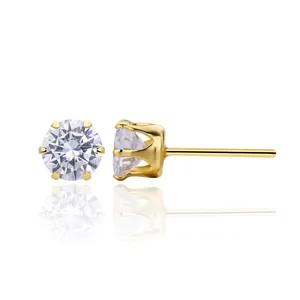 Close-up of classic 6-prong gold-plated silver stud earrings with cubic zirconia.