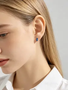 Detail shot of minimalist S925 sterling silver stud earrings with blue square zircon
