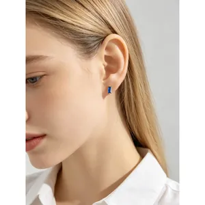 S925 silver minimalist stud earring with small rectangular blue zircon on model
