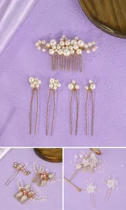 Detailed view of elegant handmade bridal hair comb and pins with faux pearls and gold wire.