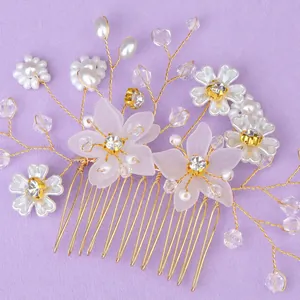 Handmade floral bridal hair comb featuring gold wire pearls and elegant crystals