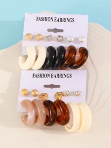 Detailed shot of a 6-pair fashion earring set featuring colorful resin hoops and elegant studs