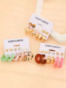 Detailed view of resin hoop and stud earring sets in various colors and patterns.