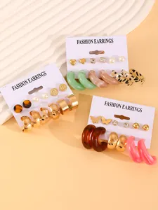 Close-up detail of a 6-piece fashion earring set featuring colorful resin hoops and studs.