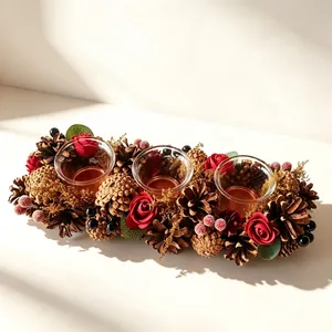 Elegant vintage Christmas candle holder centerpiece with red roses and textured pinecones
