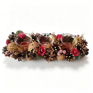 Festive Christmas wreath candle holder with red roses, pinecones, and three glass cups.