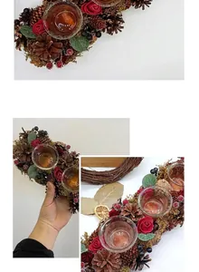 Detailed view of a festive Christmas wreath candle holder with pine cones and roses