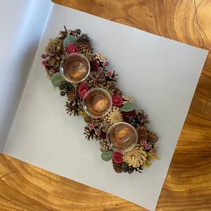 Christmas floral wreath candle holder with pinecones and glass cups for table decor