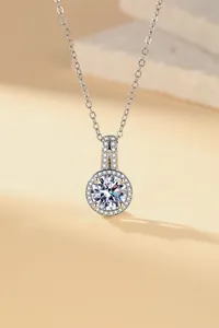Macro detail of a high-end silver pendant necklace with a large sparkling round zircon.