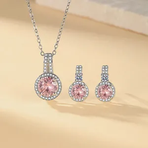 Elegant pink round zirconia necklace and earring set with shimmering pavé halo detail