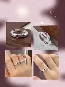 Detail of S925 wave-textured silver ring with colorful heart and star zircons.
