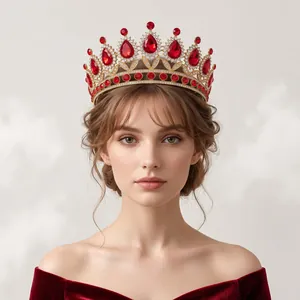 Close-up detail showing a luxury red rhinestone queen crown tiara worn by a model