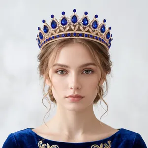 Elegant luxury vintage gold bridal tiara crown with teardrop blue crystals for wedding