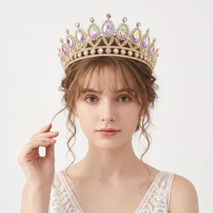Elegant luxury bridal crown featuring iridescent AB rhinestones in a gold vintage tiara design