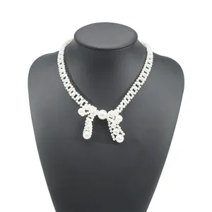 Detailed view of an elegant retro bow-knot choker necklace with white pearls