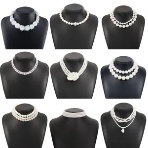 Collection of nine elegant vintage pearl chokers and multi-layer necklaces for women