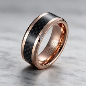 Close-up of 8mm rose gold tungsten carbide ring with black carbon fiber inlay