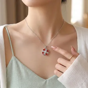 Detailed view of elegant rotating zirconia flower pendant necklace worn by female model