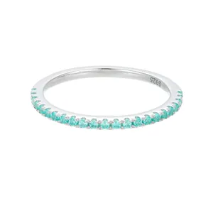 Detailed macro shot of an S925 sterling silver eternity ring with turquoise stones