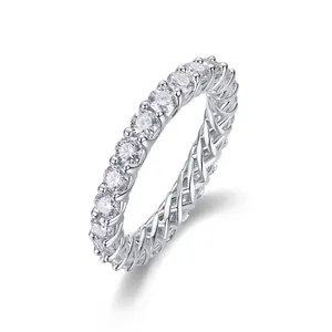 Detailed macro view of an S925 silver eternity ring set with round moissanite stones.