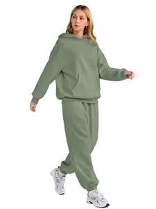 Women's oversized sage green tracksuit set featuring hoodie and jogger pants side view