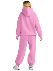 Back view of a pink oversized two-piece fleece hoodie and sweatpants tracksuit set