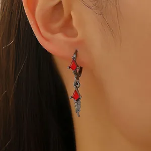 Fashionable dark metal hoop earrings featuring red zircon and star pendants for women