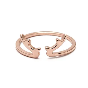 Macro detail of a rose gold stainless steel antler ring with creative open design