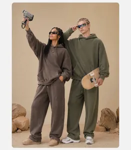 Lifestyle view of vintage washed oversized hoodies and sweatpants set in a desert scene