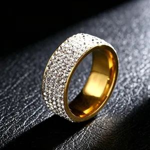Macro view of a five-row sparkling diamond ring in gold-plated titanium steel