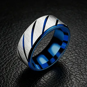 Close-up of 8mm men's stainless steel ring with brushed silver surface and blue lining.
