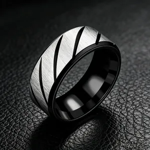 Detail of 8mm men's stainless steel ring showing brushed silver finish and black diagonal grooves.