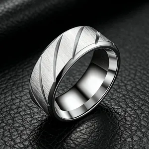 Professional detail view of 8mm stainless steel men's ring with brushed diagonal grooves