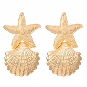 Exaggerated gold alloy starfish and scallop shell stud earrings with ocean theme
