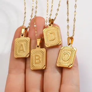 Gold-plated stainless steel square plate pendant necklace featuring embossed English letters