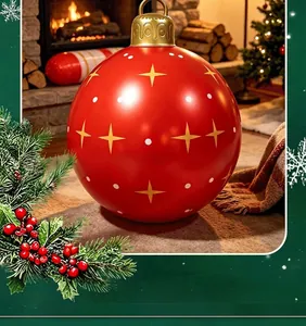 Detailed macro view of a large red inflatable PVC Christmas ball with festive gold star patterns