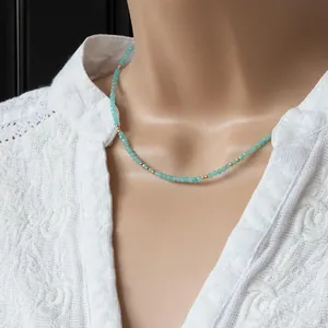 Detailed view of a handmade faceted natural stone necklace with delicate gold spacer beads