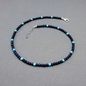 Detailed view of handmade vintage style necklace with blue and turquoise natural beads