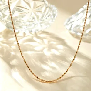 Detailed close-up of an elegant golden titanium steel rope chain necklace